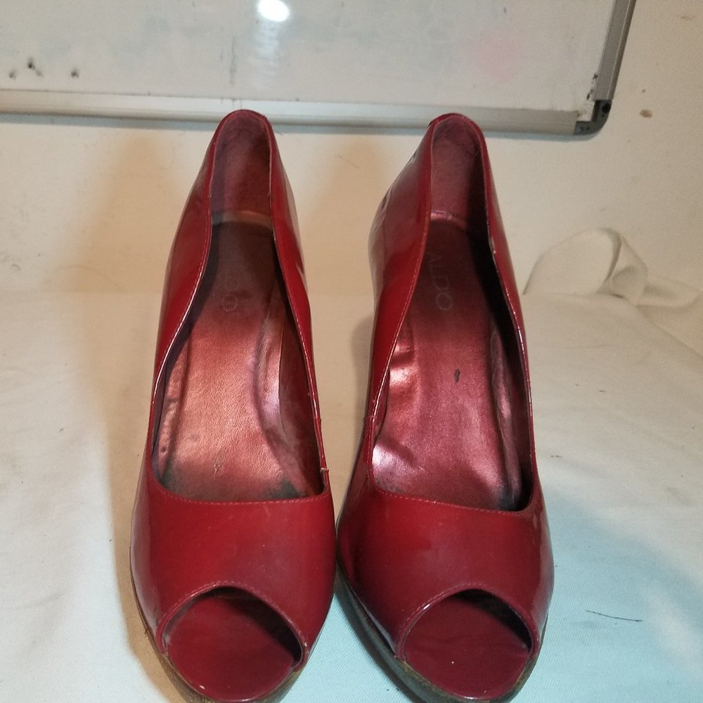 Red peep-toe pumps